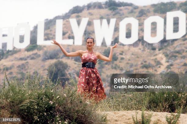 Actress and TV personality Allegra Curtis poses for a portrait under the Hollywood sign in 1988 in Los Angeles, California.