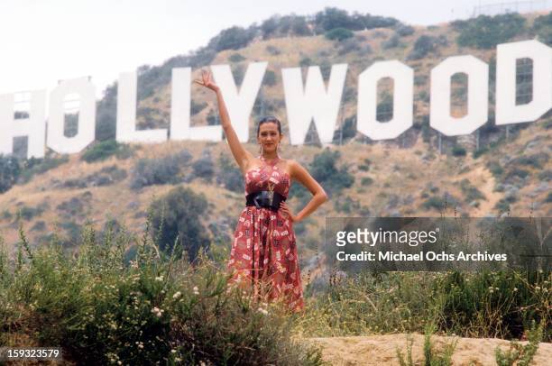 Actress and TV personality Allegra Curtis poses for a portrait under the Hollywood sign in 1988 in Los Angeles, California.