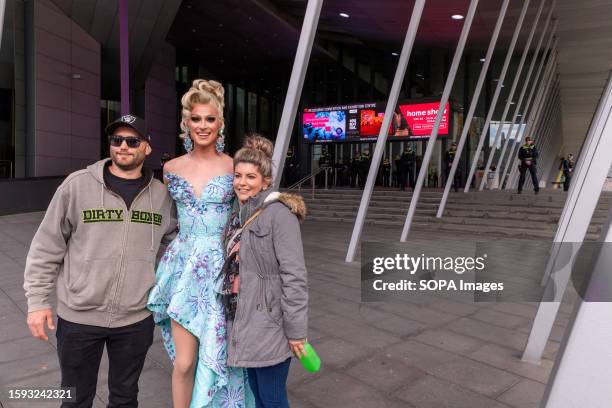 Drag queen poses for photos with the people during a demonstration at the Melbourne Convention Center. Protesters and counter protesters clash with...