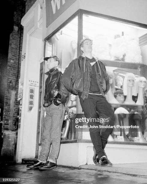 Singer Neil Tennant and keyboard player Chris Lowe of English electronic dance music duo the Pet Shop Boys, outside a wig shop in Soho, London in...