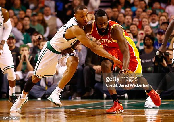 Avery Bradley of the Boston Celtics knocks the ball out of the hands of James Harden of the Houston Rockets during the game on January 11, 2013 at TD...