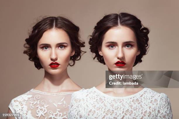 beautiful twins - lace dress stock pictures, royalty-free photos & images
