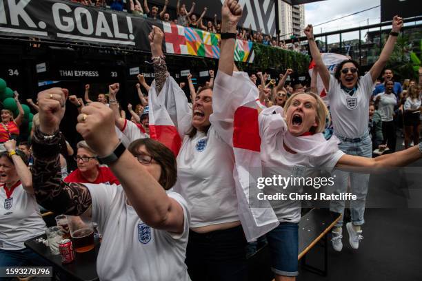 England football fans celebrate a goal as they watch the FIFA Women's World Cup 2023 Quarter Final match between England and Colombia at Boxpark...