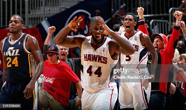 Louis Williams of the Atlanta Hawks reacts after hitting a three-point basket in the final seconds against Paul Millsap of the Utah Jazz at Philips...