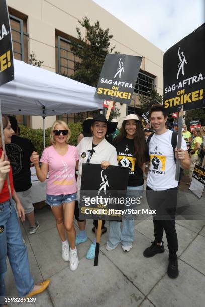 Katrina Law and Juliana Harkavy walk the picket line in support of the SAG-AFTRA and WGA strike at Warner Brothers Studios on August 11, 2023 in...