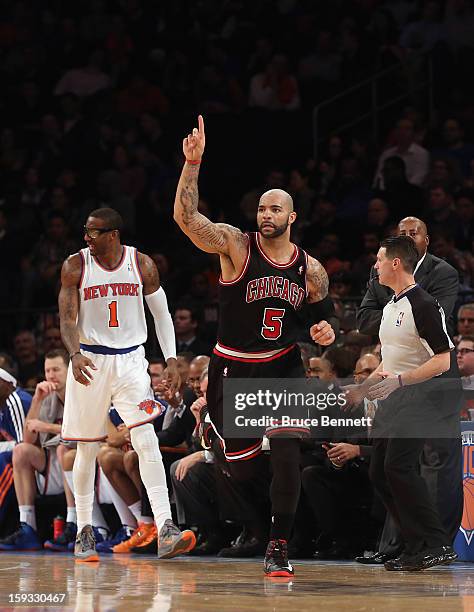 Carlos Boozer of the Chicago Bulls scores two in the fourth quarter against the New York Knicks at Madison Square Garden on January 11, 2013 in New...