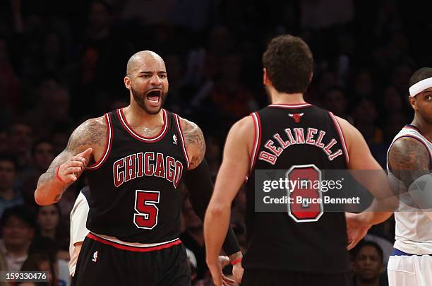 Carlos Boozer of the Chicago Bulls scores two in the third quarter and draws a foul against the New York Knicks at Madison Square Garden on January...