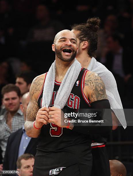 Carlos Boozer of the Chicago Bulls celebrates in the closing minute of the Bulls 108-101 victory over the New York Knicks at Madison Square Garden on...