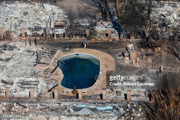 Lahaina, Maui, Thursday, August 11, 2023 - People begin to filter back to the burn zone where hundreds of homes and buildings were destroyed by...