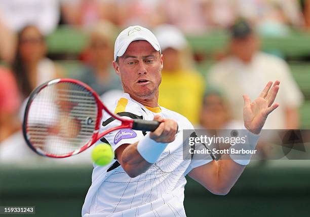 Lleyton Hewitt of Australia plays a backhand during his match against Juan Martín del Potro of Argentina during day four of the AAMI Classic at...