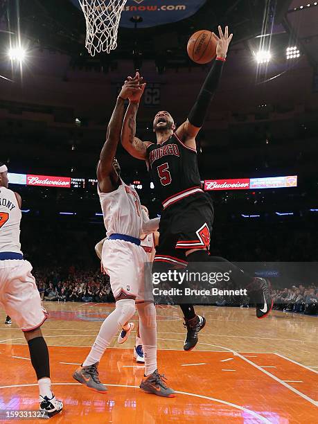 Carlos Boozer of the Chicago Bulls goes up looking for two against the New York Knicks at Madison Square Garden on January 11, 2013 in New York City....