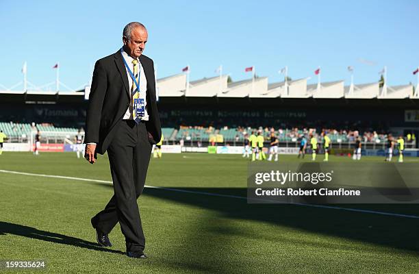 Mariners coach Graham Arnold walks from the ground after he was sent off during the round 16 A-League match between the Melbourne Victory and the...