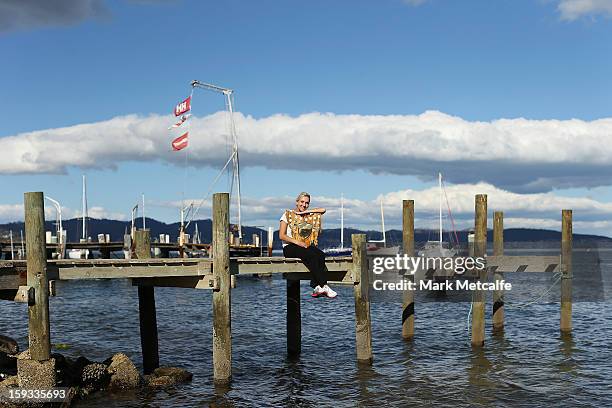 Elena Vesnina of Russia poses with the winners trophy on a visit to Battery Point after victory in the Women's singles final match against Mona...