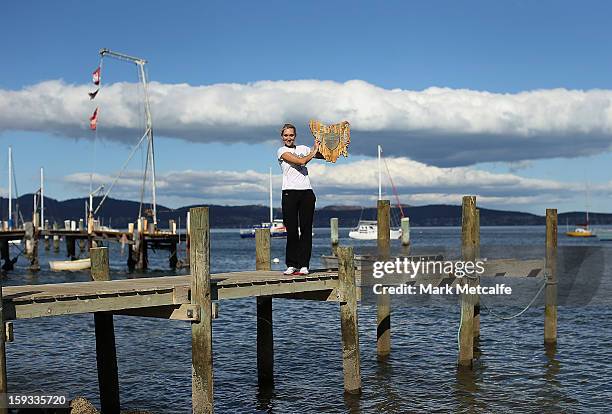 Elena Vesnina of Russia poses with the winners trophy on a visit to Battery Point after victory in the Women's singles final match against Mona...