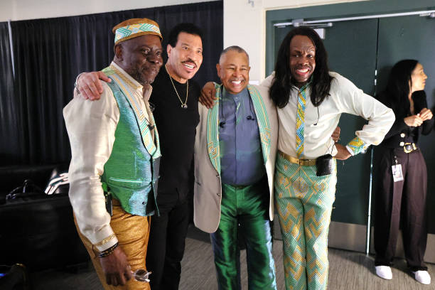 Philip Bailey, Lionel Richie, Ralph Johnson and Verdine White of Earth, Wind & Fire backstage during the opening night of "Sing A Song All Night...