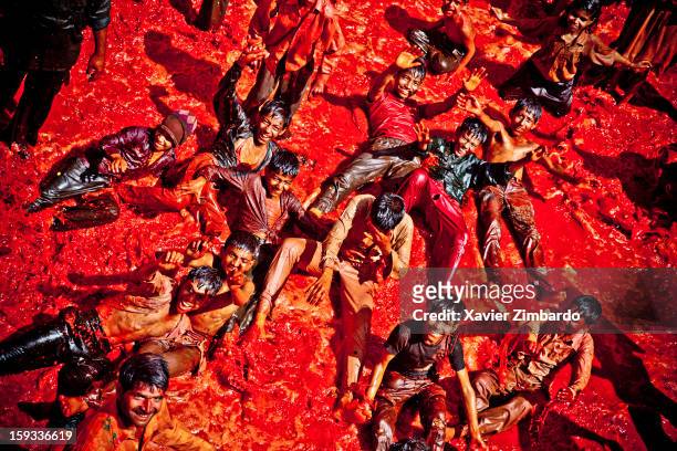 Children playing after the celebration of the Hindu Holi festival at a temple while crowds of pilgrims are playing Huranga Holi on March 12 at Dauji...