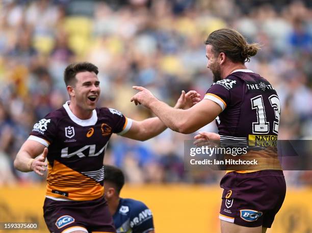 Patrick Carrigan of the Broncos celebrates after scoring a try during the round 23 NRL match between North Queensland Cowboys and Brisbane Broncos at...