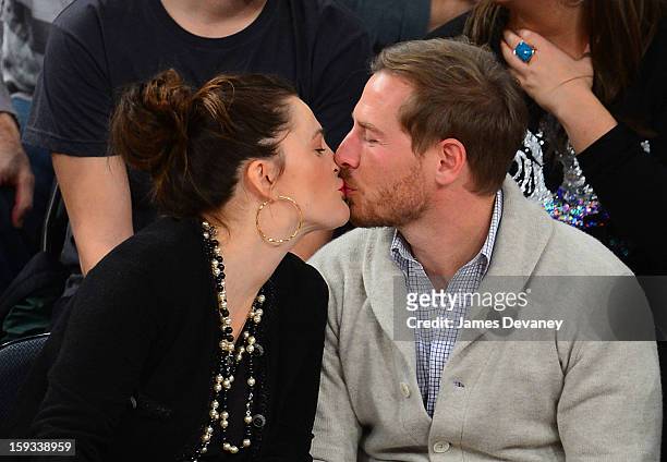 Drew Barrymore and Will Kopelman attend the Chicago Bulls vs New York Knicks game at Madison Square Garden on January 11, 2013 in New York City.
