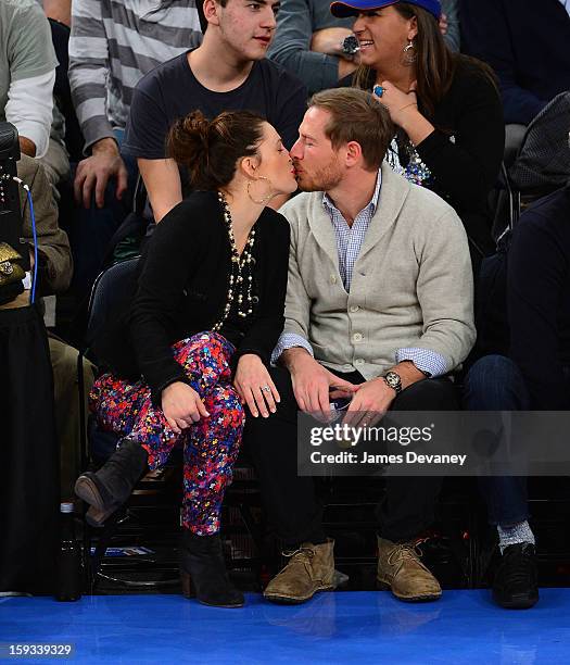 Drew Barrymore and Will Kopelman attend the Chicago Bulls vs New York Knicks game at Madison Square Garden on January 11, 2013 in New York City.