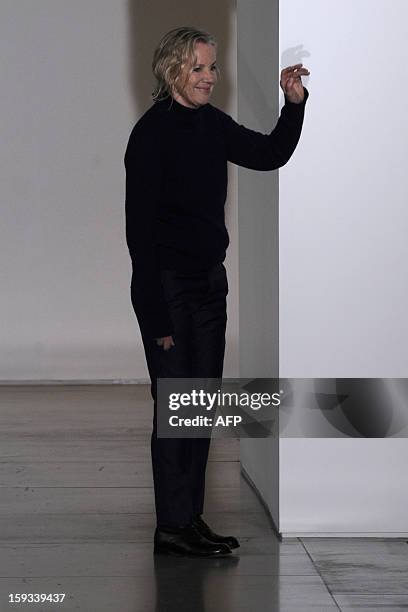 Designer Jil Sander acknowledges the audience at the end of her Fall-Winter 2013-2014 Menswear collection on January 12, 2013 during the Men's...