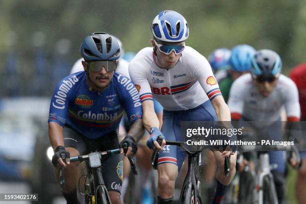 Great Britain's Finlay Graham makes contact with Colombia's Alejandro Arango in the Men's C3 Road Race during day nine of the 2023 UCI Cycling World...