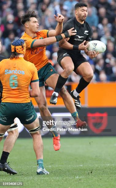 Jordan Petaia of Australia and Richie Mo’unga of New Zealand compete for the high ball during The Rugby Championship & Bledisloe Cup match between...