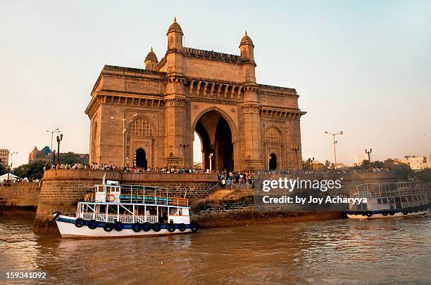 sunset at gateway of india - gateway of india stock pictures, royalty-free photos & images