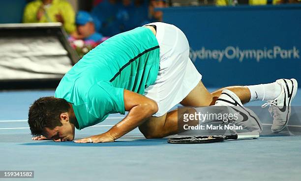 Bernard Tomic of Australia celebrates winning the Mens singles final against Kevin Anderson of South Africa during day seven of the Sydney...