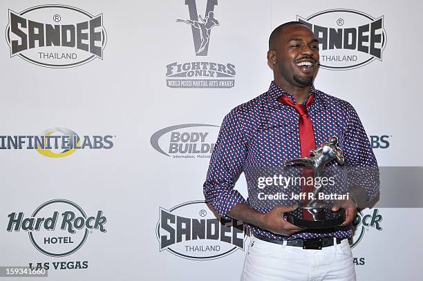Mixed martial artist Jon Jones holds the Fighter of the Year award at the Fighters Only World Mixed Martial Arts Awards at the Hard Rock Hotel &...