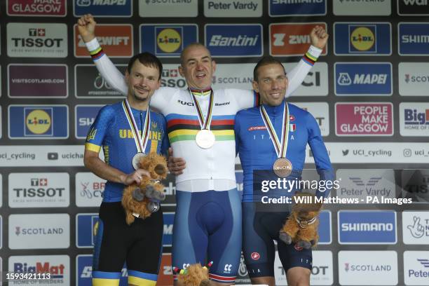 Great Britain's William Bjergfelt poses with his medal after winning the Men's C5 Road Race, alongside Ukraine's Yehor Dementyev with silver and...