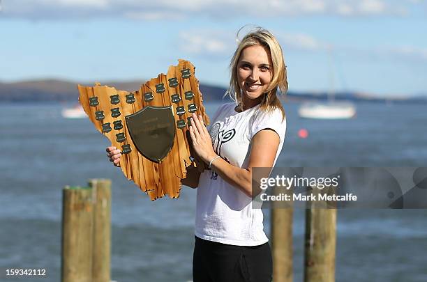 Elena Vesnina of Russia poses with the winners trophy on a visit to Battery Point after victory in the Women's singles final match against Mona...