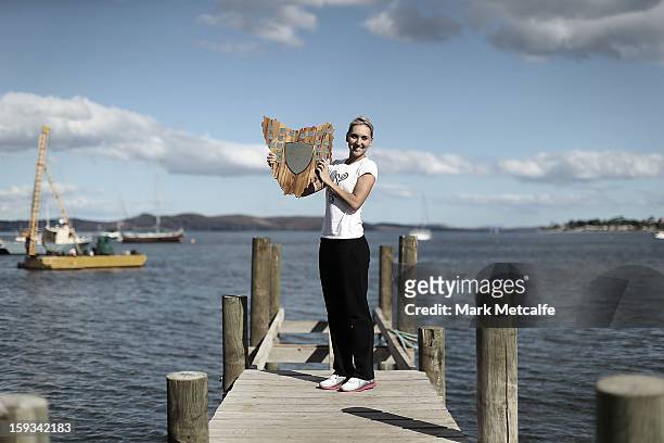 Elena Vesnina of Russia poses with the winners trophy on a visit to Battery Point after victory in the Women's singles final match against Mona...
