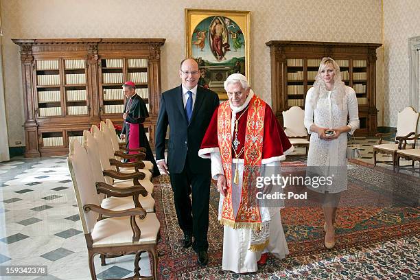 Pope Benedict XVI meets HSH Prince Albert II of Monaco and HSH Princess Charlene of Monaco during a private audience at his library on January 12,...