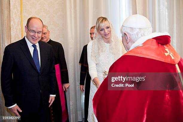 Pope Benedict XVI meets HSH Prince Albert II of Monaco and HSH Princess Charlene of Monaco during a private audience at his library on January 12,...