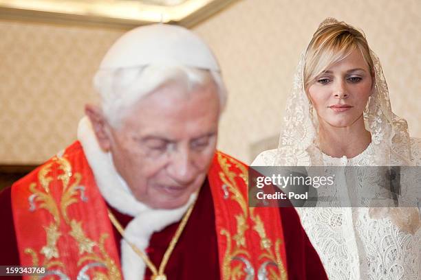 Pope Benedict XVI meets HSH Princess Charlene of Monaco during a private audience at his library on January 12, 2013 in Vatican City, Vatican.