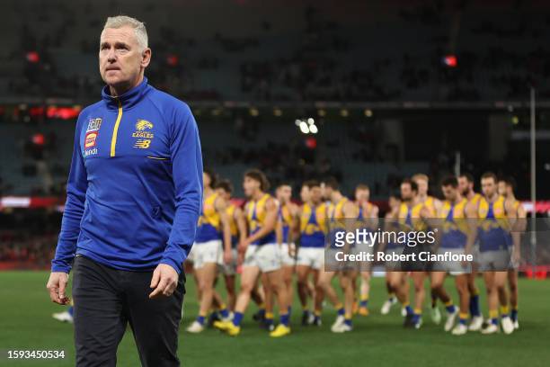 Eagles coach Adam Simpson walks off after the Eagles were defeated by the Bombers during the round 21 AFL match between Essendon Bombers and West...