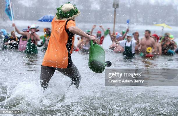 Ice swimming enthusiasts enter the cold waters of Orankesee lake during the 'Winter Swimming in Berlin' event on January 12, 2013 in Berlin, Germany....
