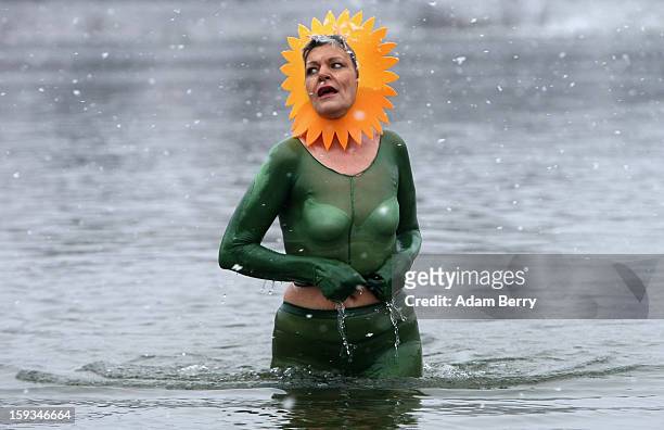 An ice swimming enthusiast wades in the cold waters of Orankesee lake during the 'Winter Swimming in Berlin' event on January 12, 2013 in Berlin,...