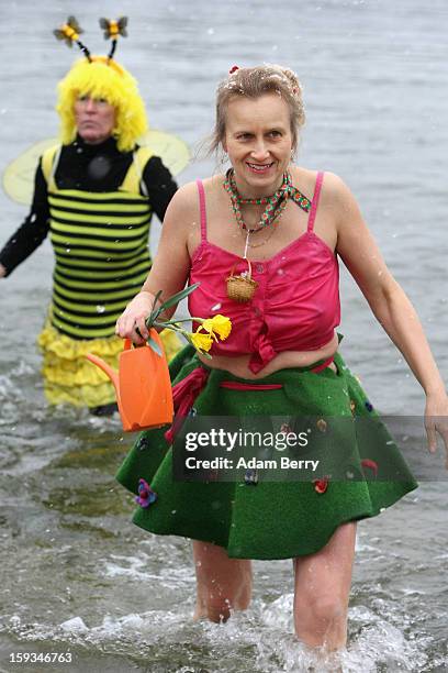 Ice swimming enthusiasts leave the cold waters of Orankesee lake during the 'Winter Swimming in Berlin' event on January 12, 2013 in Berlin, Germany....