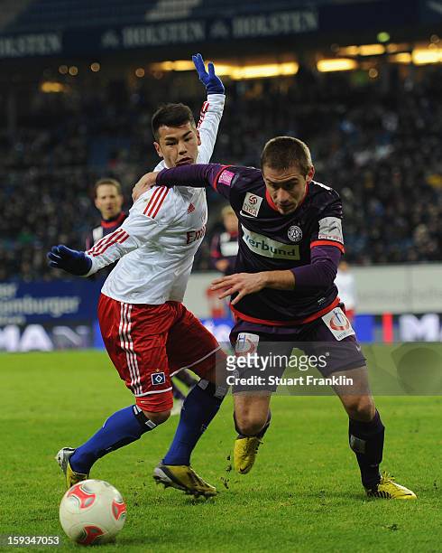 Zhi Gin Lam of Hamburg challenges for the ball with Remo Mally of Vienna during the international friendly match between Hamburger SV and Austria...