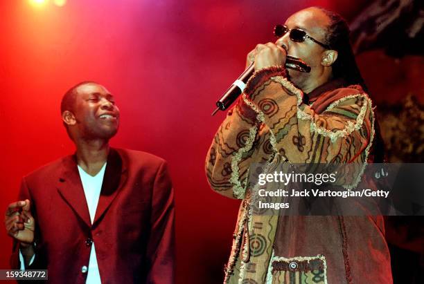 American musician Stevie Wonder joins Senegalese musician Youssou N'Dour onstage during the latter's first 'Great African Ball' concert at...