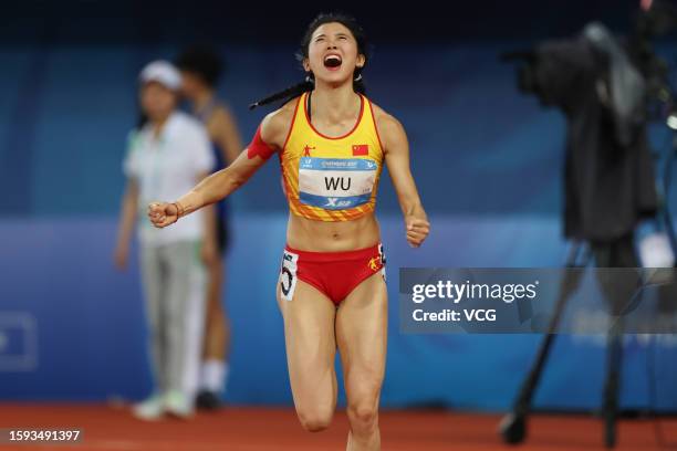 Wu Yanni of Team China celebrates after winning the second place in the Athletics - Women's 100m Hurdles Final on day 7 of 31st FISU Summer World...