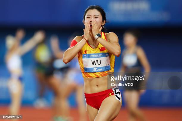Wu Yanni of Team China celebrates after winning the second place in the Athletics - Women's 100m Hurdles Final on day 7 of 31st FISU Summer World...