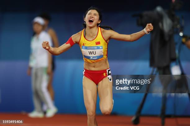 Wu Yanni of Team China celebrates after winning the second place in the Athletics - Women's 100m Hurdles Final on day 7 of 31st FISU Summer World...