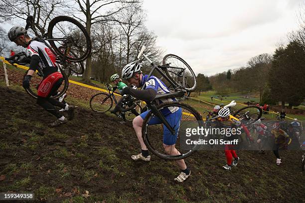 Competitors run up a hill as they take part in the 'Veteran 40-49 Men' category race at the 2013 National Cyclo-Cross Championships in Peel Park on...