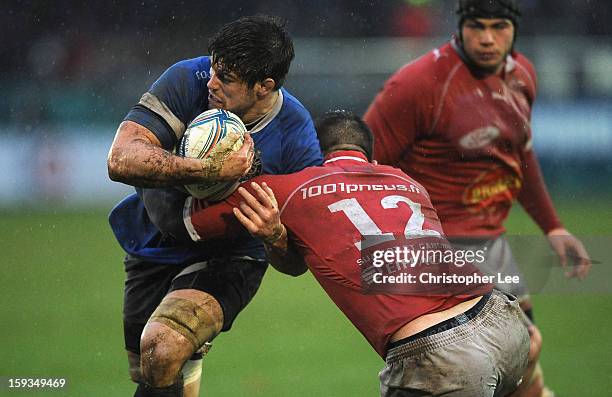 Guy Mercer of Bath battles with Benjamin Petre of Agen during the Amlin Challenge Cup Pool 4 Round 5 match between Bath Rugby and SU Agen at...