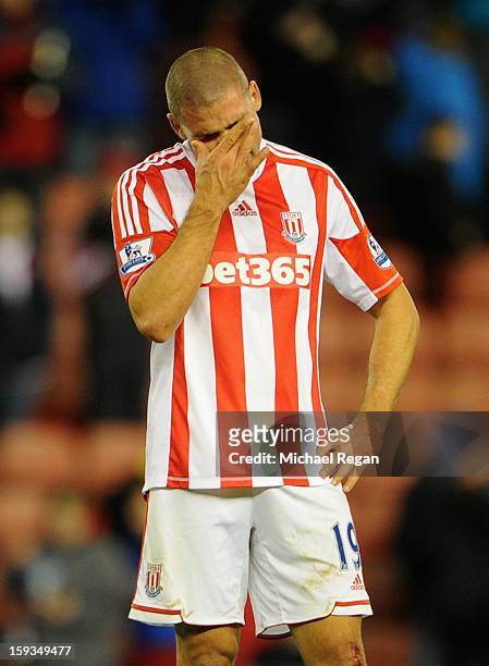 Jonathan Walters of Stoke City reacts after missing a penalty during the Barclays Premier League match between Stoke City and Chelsea at the...