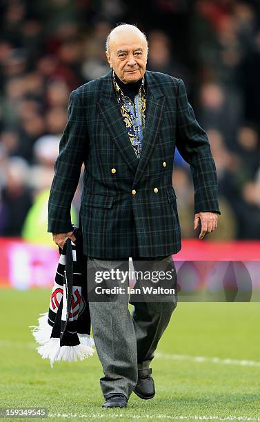 Mohammed Al Fayed the Fulham Chairman walks out onto the pitch prior to kickoff during the Barclays Premier League match between Fulham and Wigan...