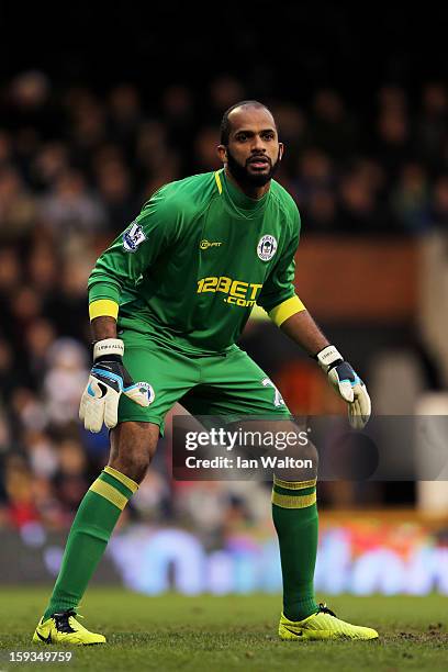 Goalkeeper Ali Al Habsi of Wigan in action during the Barclays Premier League match between Fulham and Wigan Athletic at Craven Cottage on January...