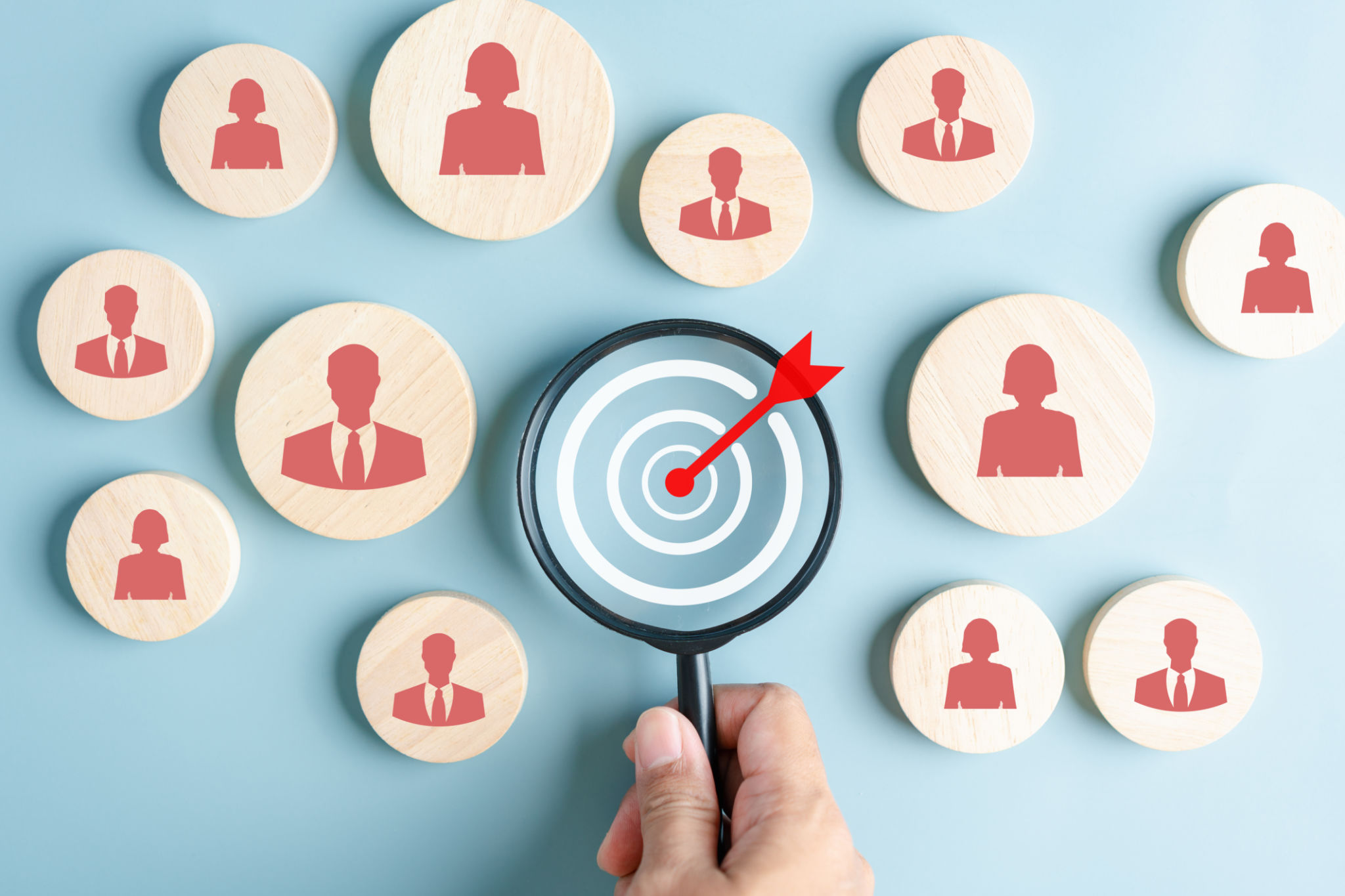 HRM or Human Resource Management, Magnifier glass focus to manager icon which is among staff icons for human development recruitment leadership and customer target group concept. HRM or Human Resource Management, Magnifier glass focus to manager icon which is among staff icons for human development recruitment leadership and customer target group concept.